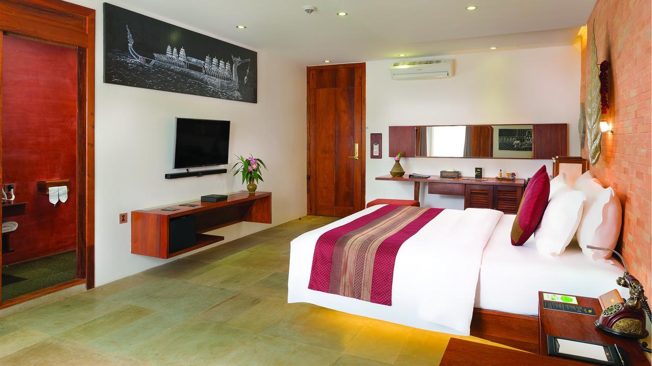 Golden Temple Residence Siem Reap Exterior foto A bedroom at the hotel